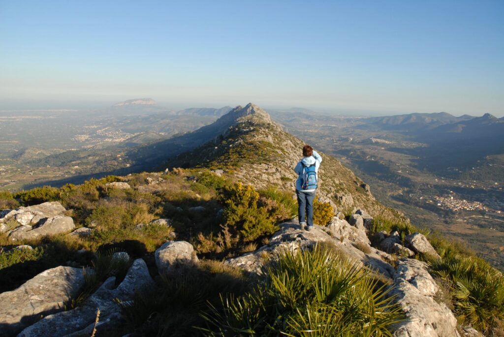 Woman Standing On The Ridge Of The Caval Verd Taking A Photo Of The View To Montgo Mountain Javea And T20 2wdrbe.jpg